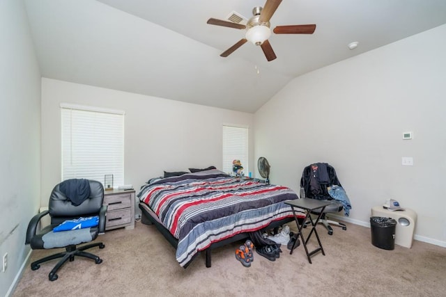 bedroom featuring light carpet, vaulted ceiling, and ceiling fan