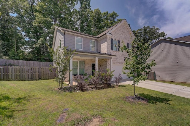 view of front property with a front lawn and a garage