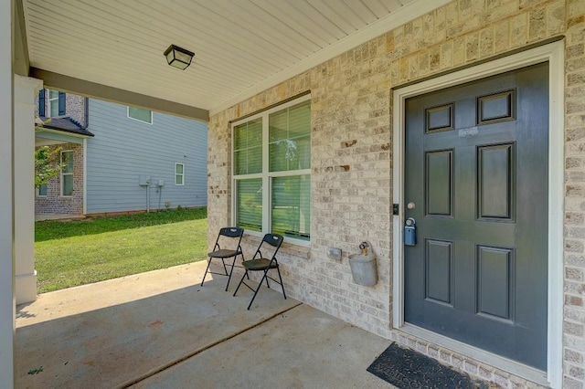 entrance to property featuring a porch