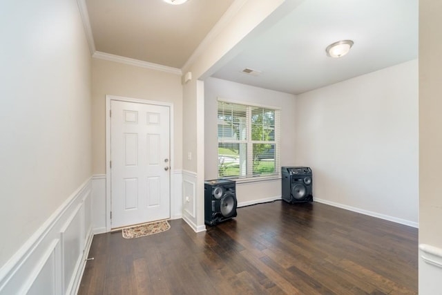 entryway featuring crown molding and dark hardwood / wood-style floors