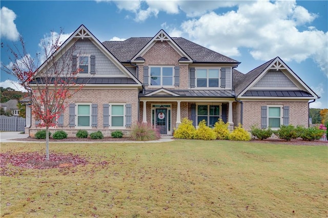 craftsman-style home with a front yard