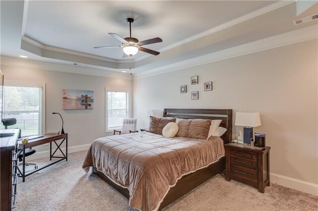 carpeted bedroom featuring ceiling fan, multiple windows, and crown molding