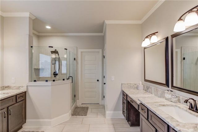 bathroom with vanity, an enclosed shower, and crown molding