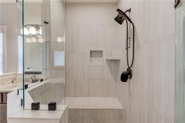 bathroom with tiled shower