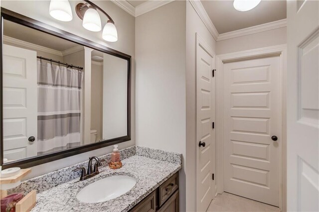 bathroom with vanity and crown molding