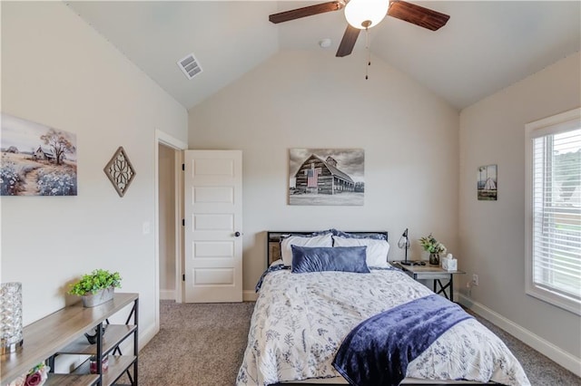 carpeted bedroom featuring ceiling fan and vaulted ceiling