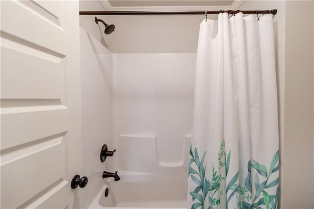 bathroom featuring shower / bathtub combination with curtain