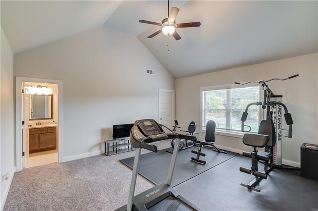 exercise area with ceiling fan, carpet flooring, and high vaulted ceiling