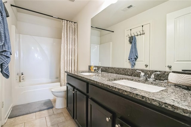 bathroom featuring toilet, shower / tub combo with curtain, tile patterned floors, and double vanity