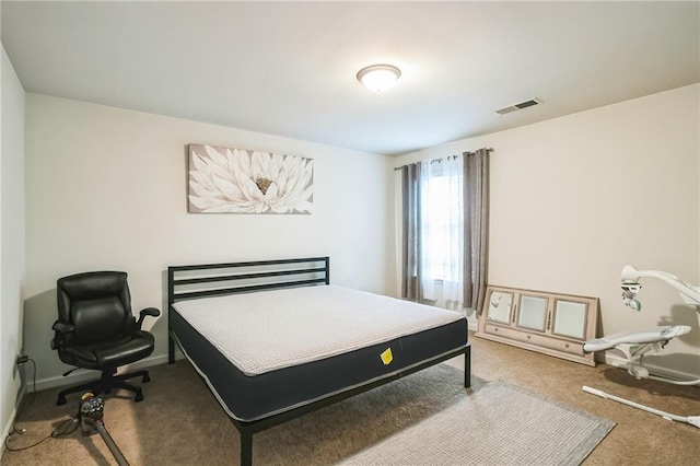 carpeted bedroom featuring baseboards