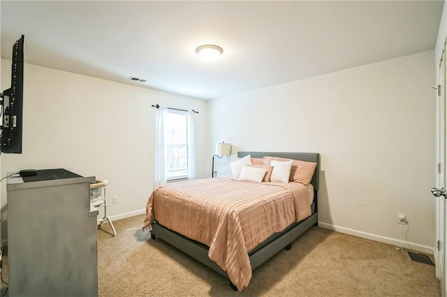bedroom with carpet flooring and baseboards