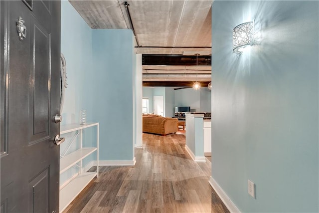 hall with hardwood / wood-style floors