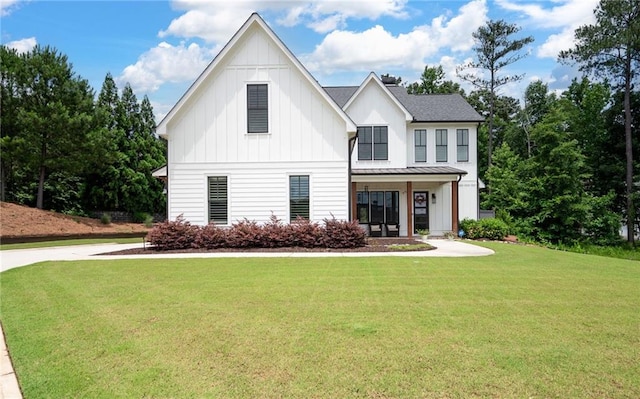 modern inspired farmhouse featuring a front lawn and a porch