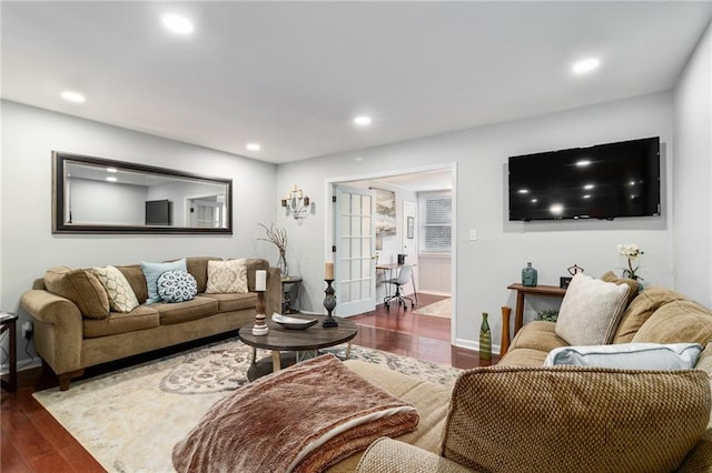 living room with recessed lighting, baseboards, and wood finished floors