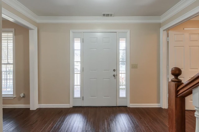 foyer entrance featuring dark hardwood / wood-style flooring and crown molding