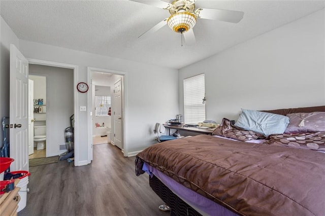 bedroom with wood finished floors, baseboards, ensuite bath, ceiling fan, and a textured ceiling