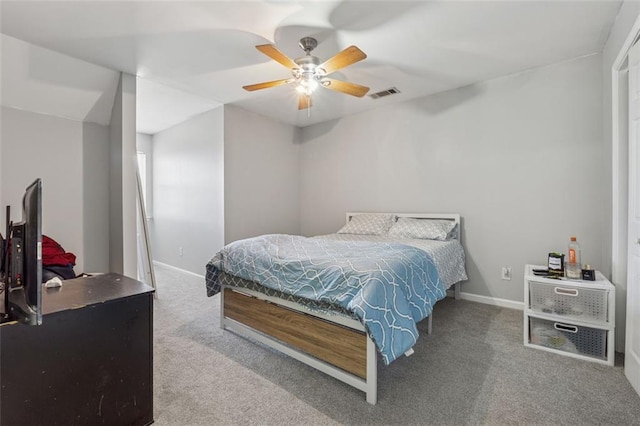 bedroom featuring visible vents, baseboards, carpet, and a ceiling fan