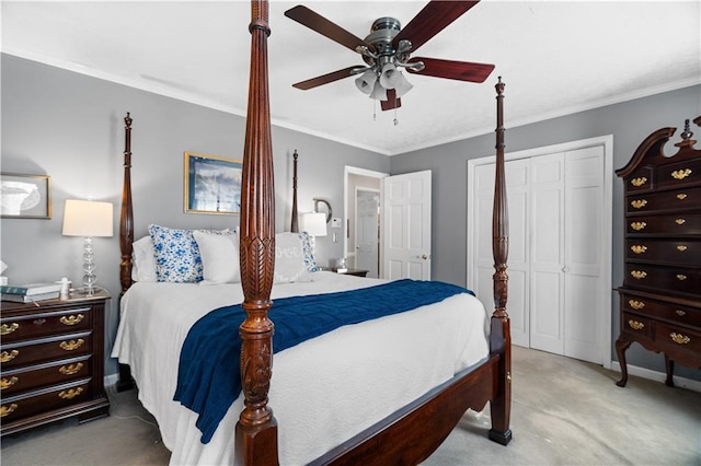 bedroom featuring light carpet, a closet, ceiling fan, and crown molding