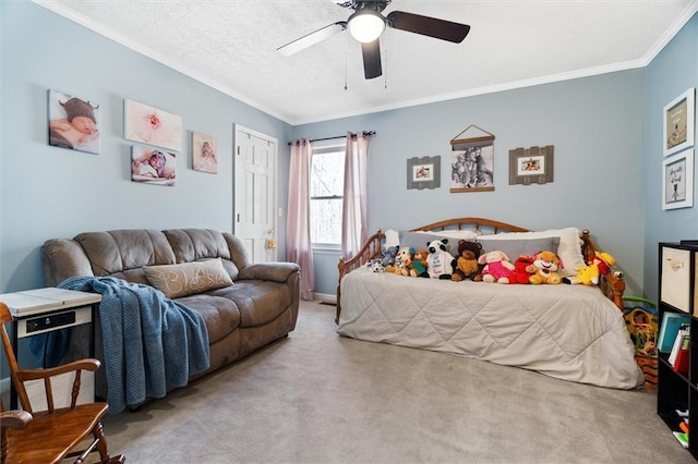 carpeted bedroom featuring a textured ceiling, ceiling fan, and ornamental molding