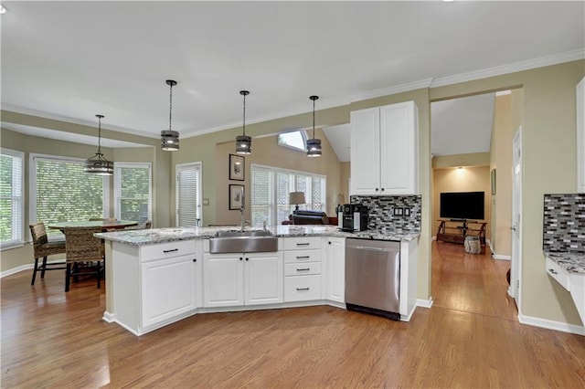 kitchen with sink, dishwasher, backsplash, light hardwood / wood-style floors, and decorative light fixtures