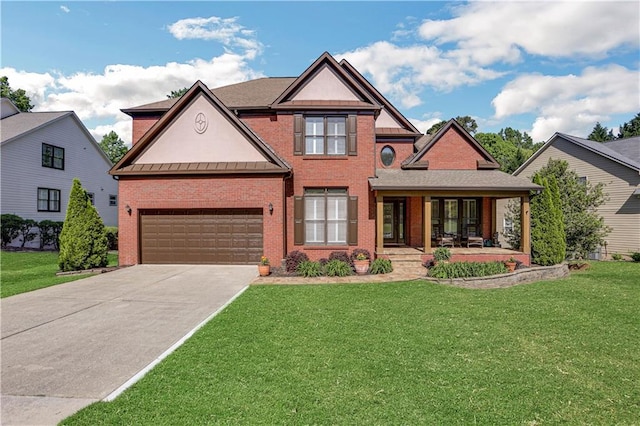 view of front of house with a front yard and a garage