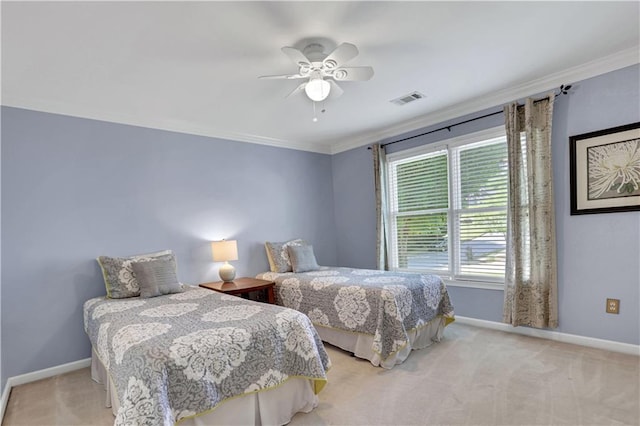 carpeted bedroom featuring ornamental molding and ceiling fan