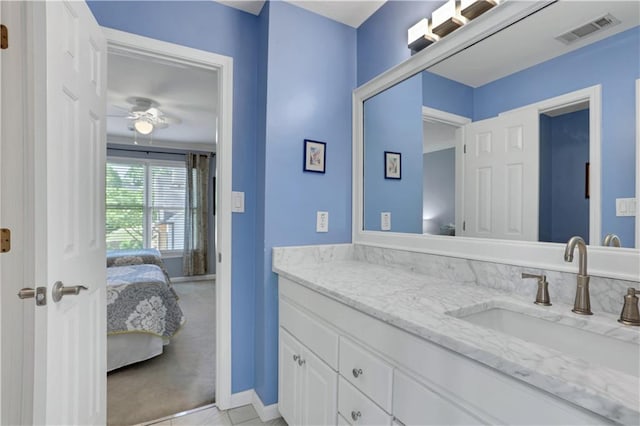 bathroom featuring tile flooring, ceiling fan, and vanity