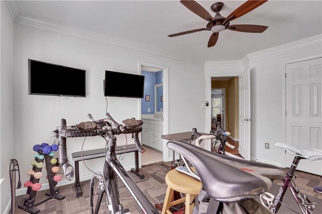 interior space with crown molding and ceiling fan