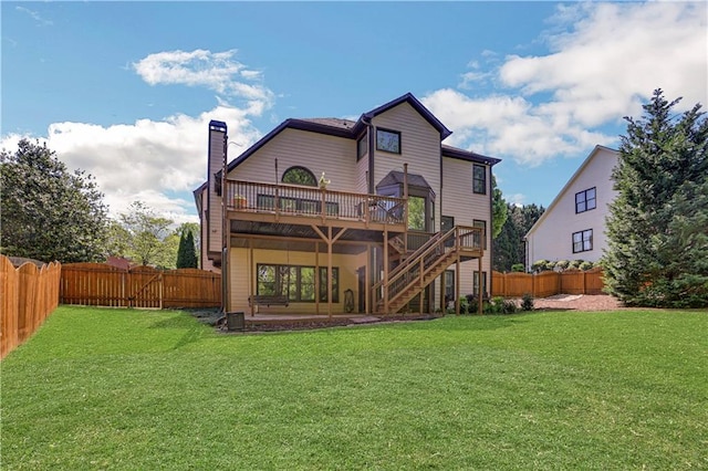 rear view of property with a lawn, a patio area, central AC, and a wooden deck