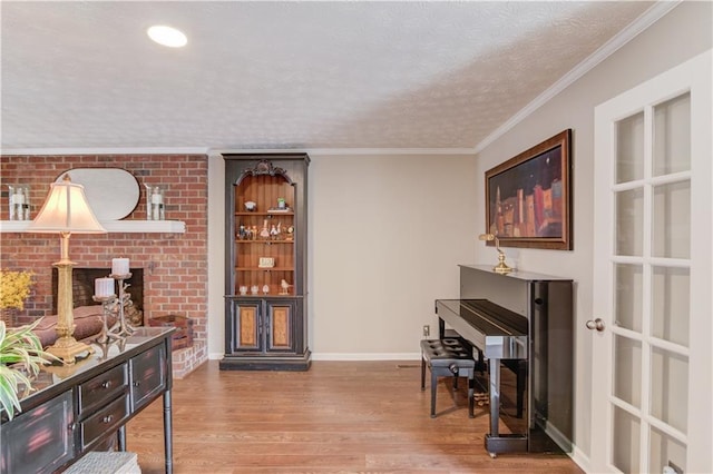 82 Cedar Blf, Winder, GA 30680 - sitting room with wood finished floors and a textured ceiling