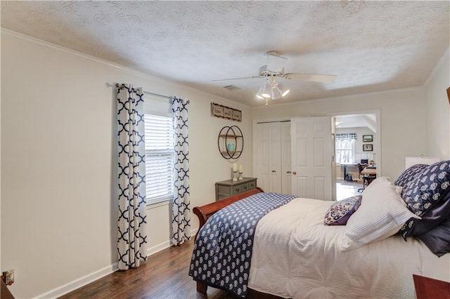 82 Cedar Blf, Winder, GA 30680 - bedroom featuring dark wood finished floors, a closet, ornamental molding, and ceiling fan