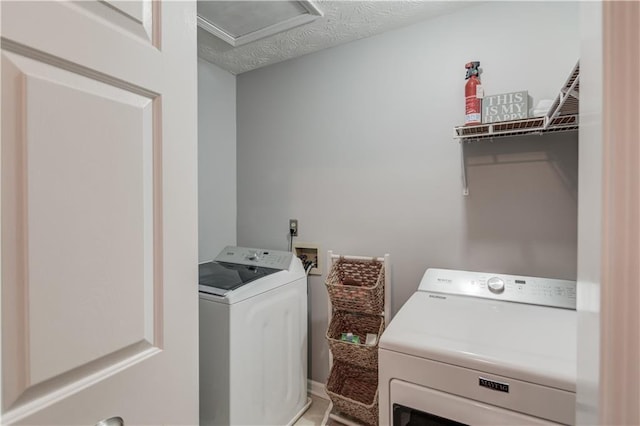 82 Cedar Blf, Winder, GA 30680 - laundry room with washing machine and dryer and attic access