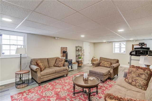82 Cedar Blf, Winder, GA 30680 - living area featuring wood finished floors, a wood stove, a paneled ceiling, and recessed lighting