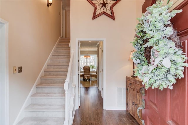 82 Cedar Blf, Winder, GA 30680 - stairs featuring wood finished floors and a high ceiling