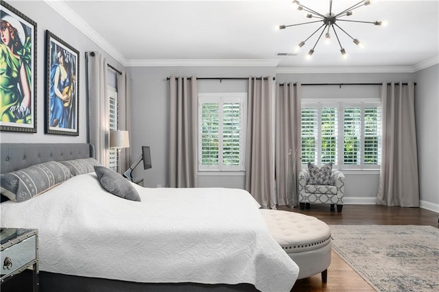 bedroom featuring crown molding, a notable chandelier, wood finished floors, and baseboards