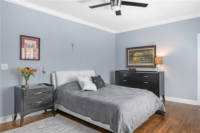 bedroom with ceiling fan, baseboards, ornamental molding, and dark wood finished floors