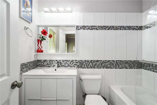 bathroom featuring tile walls, backsplash, toilet, and vanity