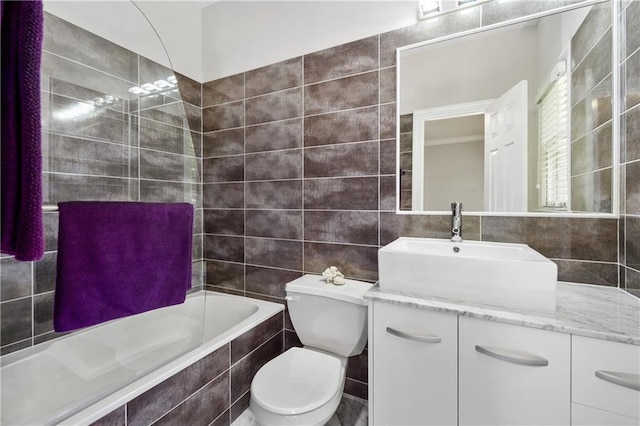 bathroom featuring vanity, tile walls, toilet, and decorative backsplash