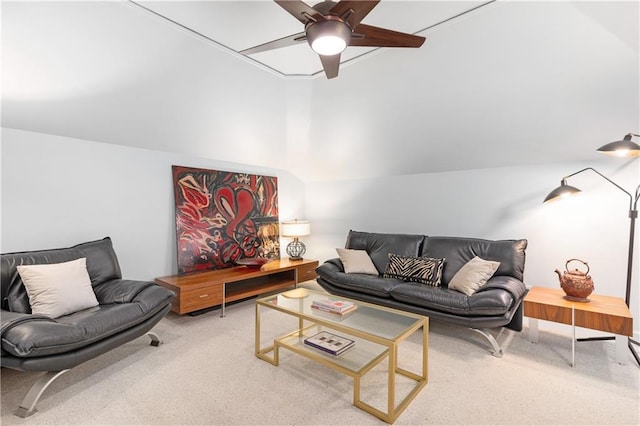 living area featuring ceiling fan, carpet, and vaulted ceiling