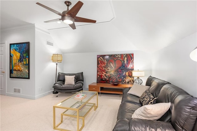 living area with lofted ceiling, carpet, visible vents, and baseboards