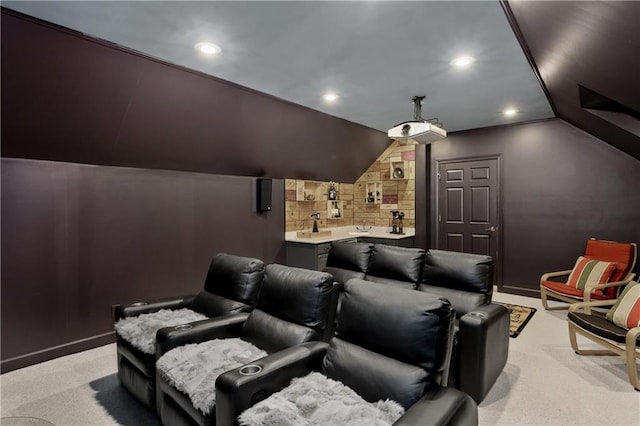 home theater featuring light carpet, recessed lighting, and vaulted ceiling