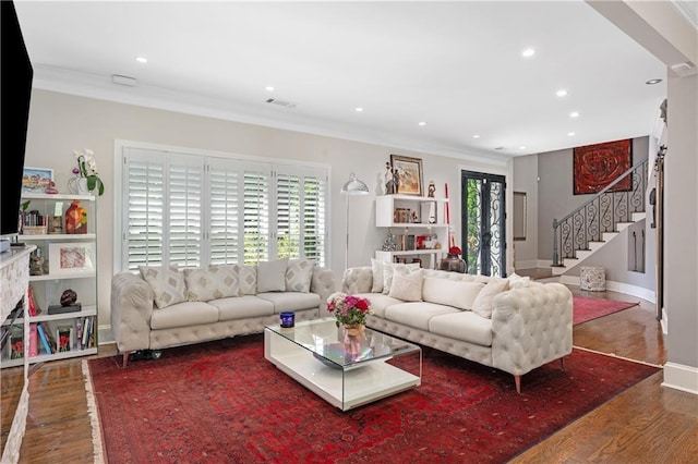 living room with visible vents, crown molding, stairway, recessed lighting, and wood finished floors