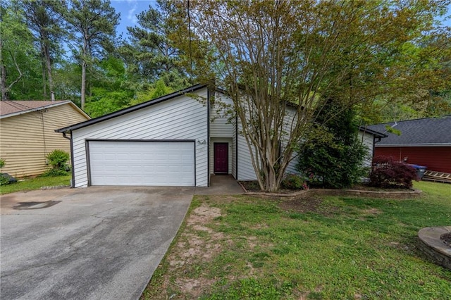 mid-century home with a front lawn and a garage