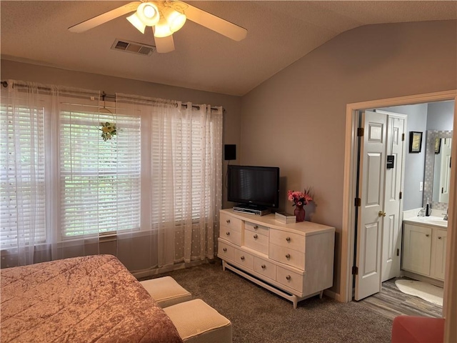 4172 Howell Park Rd, Duluth, GA 30096 - bedroom featuring vaulted ceiling, carpet floors, ensuite bathroom, and a ceiling fan