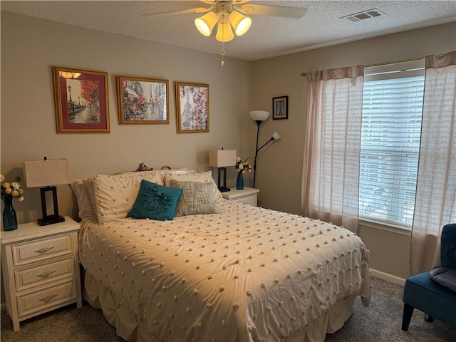 4172 Howell Park Rd, Duluth, GA 30096 - bedroom featuring dark carpet, a textured ceiling, and a ceiling fan