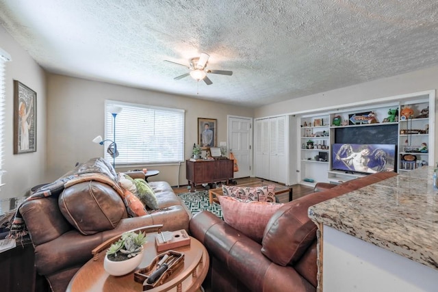 1279 Skyhaven Rd SE, Atlanta, GA 30316 - living room with ceiling fan, a textured ceiling, and wood finished floors