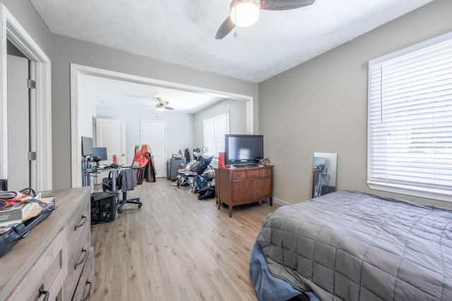 1279 Skyhaven Rd SE, Atlanta, GA 30316 - bedroom with an office area, light wood finished floors, ceiling fan, and a closet
