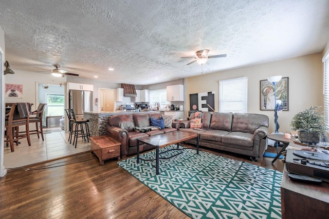 1279 Skyhaven Rd SE, Atlanta, GA 30316 - living area featuring ceiling fan, a textured ceiling, healthy amount of natural light, wood finished floors, and recessed lighting