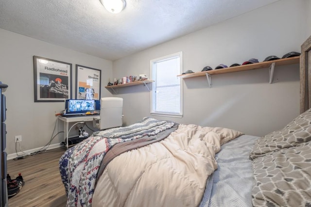 1279 Skyhaven Rd SE, Atlanta, GA 30316 - bedroom featuring wood finished floors and a textured ceiling