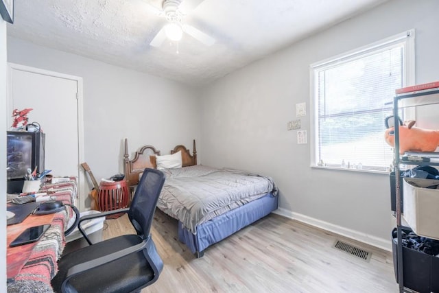 1279 Skyhaven Rd SE, Atlanta, GA 30316 - bedroom with wood finished floors and a ceiling fan
